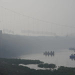 
              Rescuers on boats search in the Machchhu river next to a cable bridge that collapsed on Sunday in Morbi town of western state Gujarat, India, Wednesday, Nov. 2, 2022. A century-old cable suspension bridge collapsed into the river Machchhu on Sunday evening, sending hundreds plunging in the water in one of the country's worst accidents in years. (AP Photo/Ajit Solanki)
            