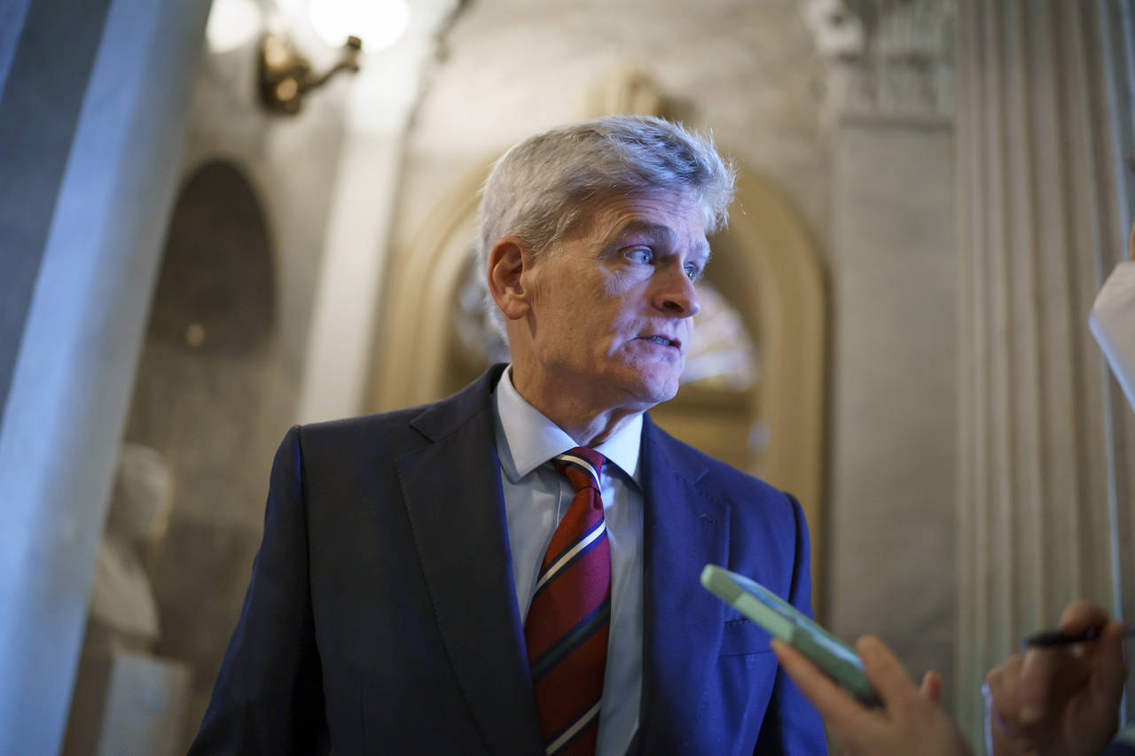 FILE - Sen. Bill Cassidy, R-La., pauses outside the chamber during a confirmation vote, at the Capi...