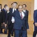 
              Vietnam's President Nguyen Xuan Phuc, center, waves as he arrives to attend the APEC Economic Leaders' Meeting during the APEC summit, Friday, Nov. 18, 2022, in Bangkok, Thailand. (Diego Azubel/Pool Photo via AP)
            