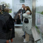 
              People who lost relatives in the downing of MH17, hug at a bus stop after the court's verdict at Schiphol airport, near Amsterdam, Netherlands, Thursday, Nov. 17, 2022. A Dutch court has convicted two Russians and a Ukrainian of the murders of 298 people who died in the 2014 downing of Malaysia Airlines flight MH17 over Ukraine. One Russian was acquitted for lack of evidence. (AP Photo/Phil Nijhuis)
            