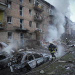 
              Ukrainian State Emergency Service firefighters work to extinguish a fire at the scene of a Russian shelling in the town of Vyshgorod outside the capital Kyiv, Ukraine, Wednesday, Nov. 23, 2022. Authorities reported power outages in multiple cities of Ukraine, including parts of Kyiv, and in neighboring Moldova after renewed strikes Wednesday struck Ukrainian infrastructure facilities. (AP Photo/Efrem Lukatsky)
            