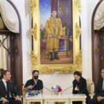 
              French President Emmanuel Macron, left, talks to Thailand's Prime Minister Prayuth Chan-ocha at the Government House, Thursday, Nov. 17, 2022, in Bangkok, Thailand. (AP Photo/Sakchai Lalit, Pool)
            