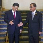 
              Chinese President Xi Jinping, left, and Thailand's Prime Minister Prayuth Chan-ocha shake hands as they meet on the sidelines of the Asia-Pacific Economic Cooperation, APEC summit, at the Government House, Saturday, Nov. 19, 2022, in Bangkok, Thailand. (Athit Perawongmetha/Pool Photo via AP)
            