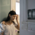 
              Lune Loh, 25, a transgender woman, leans against the door frame of her bathroom at home in Singapore, on Thursday, Aug. 18, 2022. Across the world, scores of countries still require transgender people to submit to sterilizing surgeries before their genders are legally recognized. (AP Photo/Wong Maye-E)
            
