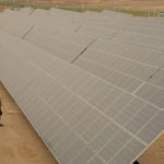 
              Engineers talk next to photovoltaic solar panels at Benban Solar Park, one of the world's largest solar power plant in the world, in Aswan, Egypt, Oct. 19, 2022. The Arab world’s most populous country is taking steps to convert to renewable energy. But the developing country, like others, faces obstacles in making the switch. (AP Photo/Amr Nabil)
            