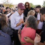 
              Beto O'Rourke, center left, Texas Democratic gubernatorial candidate, talks with supporters during a campaign stop in Dallas, Tuesday, Nov. 8, 2022. (AP Photo/Tony Gutierrez)
            
