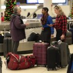 
              A Southwest Airlines employee helps travelers search for bags amongst hundreds of other checked bags at baggage claim at Midway International Airport as Southwest continues to cancel thousands of flights across the country Wednesday, Dec. 28, 2022, in Chicago. (AP Photo/Erin Hooley)
            
