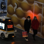 
              A police autonomous robot patrols a mall area in Beijing, Wednesday, Dec. 28, 2022. China says it will resume issuing passports for tourism in another big step away from anti-virus controls that isolated the country for almost three years, setting up a potential flood of Chinese going abroad for next month's Lunar New Year holiday. (AP Photo/Ng Han Guan)
            
