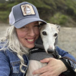 
              This photo provided by Amy Watson of Portland, Ore., shows her with her dog during a trip to the Oregon Coast in June 2022. Watson, approaching 50, says she has “never had any kind of recovery” from COVID-19. She has had severe migraines, plus digestive, nerve and foot problems. Recently she developed severe anemia. (Amy Watson via AP)
            