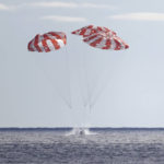 
              NASA's Orion capsule splashes down Sunday, Dec. 11, 2022, to conclude a dramatic 25-day test flight, as seen from aboard the U.S.S. Portland in the Pacific off Mexico. The mission should clear the way for astronauts on the program’s next lunar flyby, set for 2024. (Mario Tama/Pool Photo via AP)
            