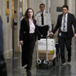 
              Documents arrive as the House Ways & Means Committee holds a hearing regarding tax returns from former President Donald Trump on Capitol Hill in Washington, Tuesday, Dec. 20, 2022. (AP Photo/Andrew Harnik)
            