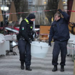 
              Police officers carry a plastic tub with rescued fish after a huge aquarium bursts in Berlin, Germany, Friday, Dec. 16, 2022. German police say a huge fish tank in the center of Berlin has burst, causing a wave of devastation in and around the Sea Life tourist attraction. (Soeren Stache/dpa via AP)
            