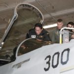 
              FILE - Japanese Prime Minister Fumio Kishida gets into the cockpit of a U.S. fighter jet during his visit to the USS Ronald Reagan, in Sagami Bay, southwest of Tokyo on Nov. 6, 2022. In a major break from its strictly self-defense-only postwar principle, Japan adopted a national security strategy Friday, Dec. 16, 2022, declaring plans to possess preemptive strike capability and cruise missiles within years to give itself more offensive footing against threats from neighboring China and North Korea. (Kyodo News via AP, File)
            