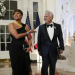 
              Actress Ariana DeBose and Henry Munoz III arrive for the State Dinner with President Joe Biden and French President Emmanuel Macron at the White House in Washington, Thursday, Dec. 1, 2022. (AP Photo/Susan Walsh)
            