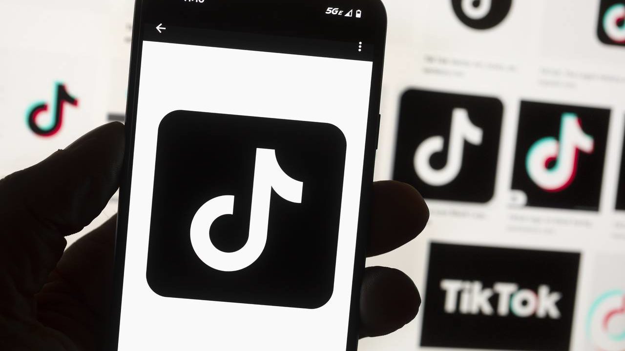 FILE - The TikTok logo is seen on a cell phone on Oct. 14, 2022, in Boston. TikTok would be banned ...