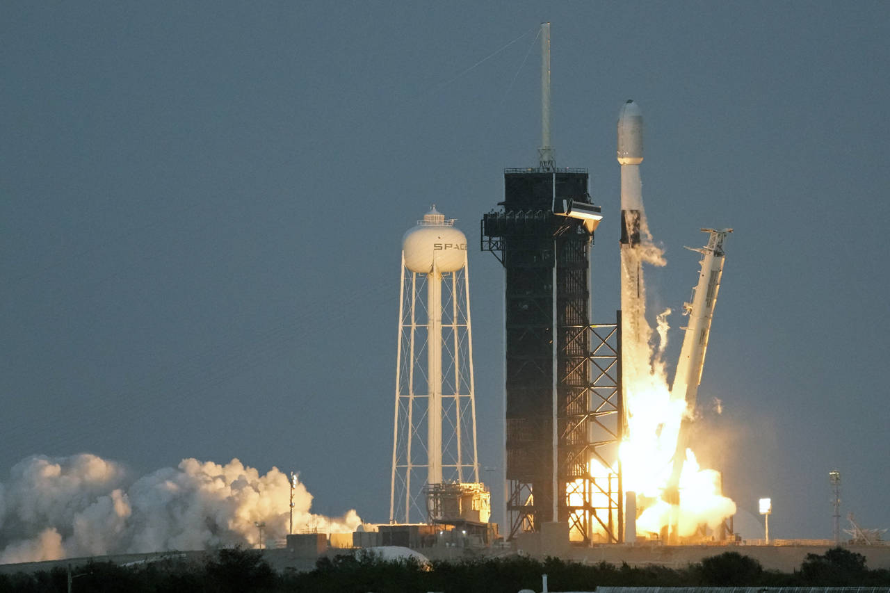 A SpaceX Falcon 9 rocket, with a payload of 40 satellites for OneWeb broadband communications, lift...