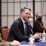 
              Australia's Defense Minister Richard Marles, center, watches media members leave the room during a talk with Japan's Defense Minister Yasukazu Hamada at the Iikura guesthouse in Tokyo, Friday, Dec. 9, 2022. (AP Photo/Hiro Komae)
            