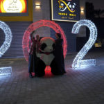 
              Palestinian women take photos of themselves in front of giant panda decorations and illuminated numbers for the new year 2023, at the main road in Gaza City, Friday, Dec. 30, 2022. (AP Photo/Adel Hana)
            