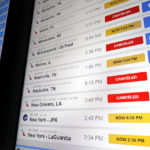 
              American Airlines flight information screens display flight information, including canceled and delayed flights, at O'Hare International Airport in Chicago, Thursday, Dec. 22, 2022. (AP Photo/Nam Y. Huh)
            