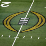 
              FILE - The College Football Playoff logo is shown on the field at AT&T Stadium before the Rose Bowl NCAA college football game between Notre Dame and Alabama in Arlington, Texas, Jan. 1, 2021. The College Football Playoff announced Thursday, Dec. 1, 2022, it will expand to a 12-team event, starting in 2024, finally completing an 18-month process that was fraught with delays and disagreements. The announcement comes a day after the Rose Bowl agreed to amend its contract for the 2024 and '25 seasons, the last hurdle CFP officials needed cleared to triple the size of what is now a four-team format. (AP Photo/Roger Steinman, File)
            