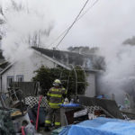
              Firefighters battle a residence fire in Rio Dell, Calif., Wednesday, Dec. 21, 2022. (AP Photo/Godofredo A. Vásquez)
            
