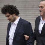 
              FTX founder Sam Bankman-Fried leaves court following his extradition to the U.S., Thursday, Dec. 22, 2022, in New York. Bankman-Fried's parents agreed to sign a $250 million bond and keep him at their California home while he awaits trial on charges that he swindled investors and looted customer deposits on his FTX trading platform. (AP Photo/Yuki Iwamura)
            