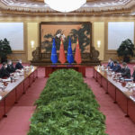 
              In this photo released by Xinhua News Agency, Chinese President Xi Jinping, second from left, speaks during a meeting with European Council President Charles Michel at the Great Hall of the People in Beijing, Thursday, Dec. 1, 2022. (Zhang Ling/Xinhua via AP)
            