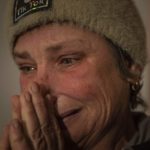 
              Maryna Semeniuk cries at her house in Vysoke village, Kherson region, Ukraine, Saturday, Dec. 3, 2022. Semeniuk's husband Mykola was injured by Russian soldiers in November and forcibly moved to Crimea, as well two of her sons were captured by Russian forces in July. (AP Photo/Evgeniy Maloletka)
            