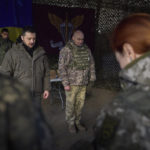 
              In this photo provided by the Ukrainian Presidential Press Office, Ukrainian President Volodymyr Zelenskyy, centre left, stands along servicemen during a minute of silence in honor of soldiers killed during fighting with Russian troops as he visits the Sloviansk, Donbas region, Ukraine, Tuesday, Dec. 6, 2022. (Ukrainian Presidential Press Office via AP)
            