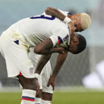 
              Haji Wright of the United States is comforted after losing the World Cup round of 16 soccer match between the Netherlands and the United States, at the Khalifa International Stadium in Doha, Qatar, Saturday, Dec. 3, 2022. (AP Photo/Martin Meissner)
            