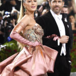 
              FILE - Blake Lively, left, and Ryan Reynolds attend The Metropolitan Museum of Art's Costume Institute benefit gala on Monday, May 2, 2022, in New York. Parties are back, and they've brought with them the potential for some dress code chaos. White tie, black tie, black tie creative/festive, semi-formal. Pre-pandemic guidelines for attire in an exhausted world more used to sweats and sneakers may take some extra re-entry energy. (Photo by Evan Agostini/Invision/AP, File)
            