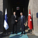 
              In this photo provided by the Turkish Defense Ministry, Turkish Defense Minister Hulusi Akar, right, and Finnish Defense Minister Antti Kaikkonen shake hands during a welcome ceremony in Ankara, Turkey, Thursday, Dec. 8, 2022. (Turkish Defense Ministry via AP)
            