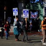 
              Graduate student instructors and researchers picket at University of California, Berkeley's Sather Gate during the fourth week of a strike by academic workers at the 10-campus UC system in Berkeley, Calif., Wednesday, Dec. 7, 2022. A month into the nation's largest strike involving higher education, classes are being cancelled and important research is being disrupted at the 10 campuses of the University of California. (AP Photo/Terry Chea)
            