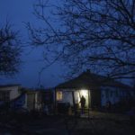 
              Maryna Semeniuk walks in the yard in front of her house in Vysoke village, Kherson region, Ukraine, Saturday, Dec. 3, 2022. Semeniuk's husband Mykola was injured by Russian soldiers in November and forcibly moved to Crimea, as well two of her sons were captured by Russian forces in July. (AP Photo/Evgeniy Maloletka)
            