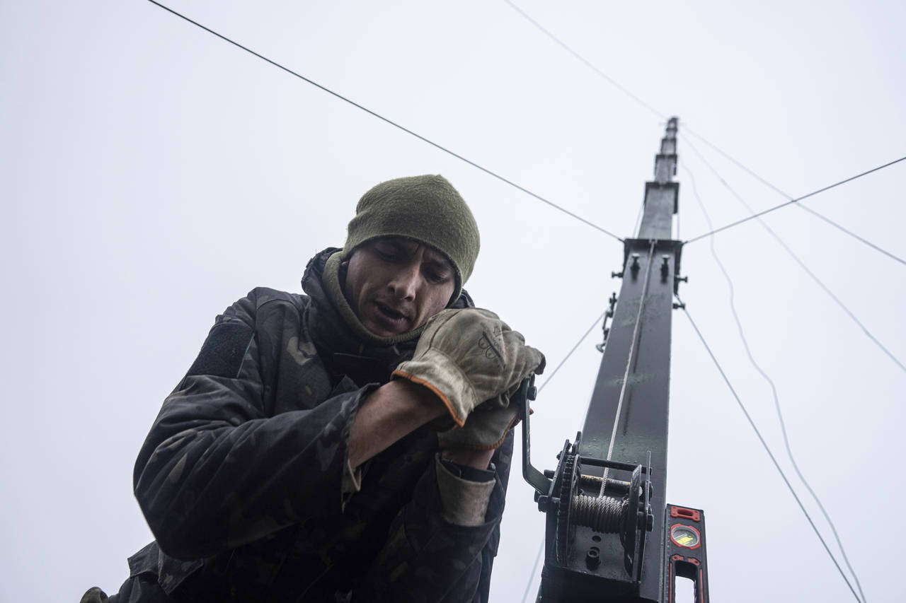 Ukrainian servicemen from 127 brigade prepare a telescopic tower with a remote camera installed on ...