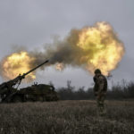 
              Ukrainian soldiers fire a French-made CAESAR self-propelled howitzer towards Russian positions near Avdiivka, Donetsk region, Ukraine, Monday, Dec. 26, 2022. (AP Photo/Libkos)
            