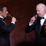 
              President Joe Biden and French President Emmanuel Macron toast during a State Dinner on the South Lawn of the White House in Washington, Thursday, Dec. 1, 2022. (AP Photo/Andrew Harnik)
            