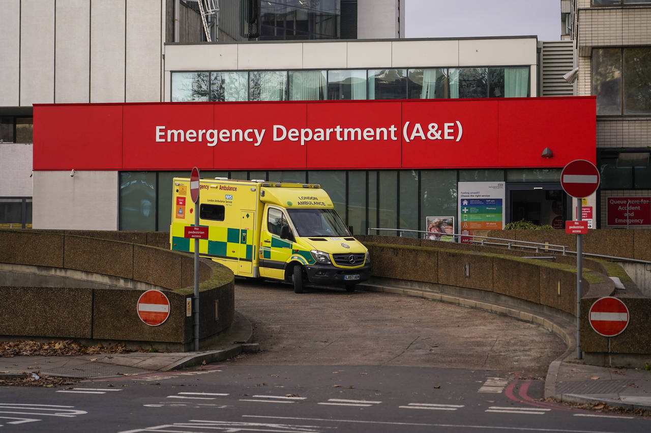 An ambulance is parked outside St Thomas' Hospital, in London, Thursday, Dec. 1, 2022. Some 10000 a...