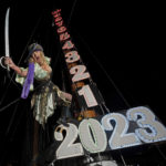 
              In this Friday, Dec. 30, 2022, photo provided by the Florida Keys News Bureau, Evalena Worthington rehearses being lowered from the mast of a sailing vessel at the Schooner Wharf Bar in Key West, Fla. The Pirate Wench Drop is one of several Key West celebrations set for New Year's Eve to celebrate the dawn of 2023. Others include a drag performer, a giant reproduction of a conch shell and a faux tuna fish to be lowered at other local bars. (Rob O'Neal/Florida Keys News Bureau via AP)
            