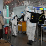 
              Passengers in protective gear are directed to a flight at a Capital airport terminal in Beijing, Tuesday, Dec. 13, 2022. Some Chinese universities say they will allow students to finish the semester from home in hopes of reducing the potential of a bigger COVID-19 outbreak during the January Lunar New Year travel rush. (AP Photo/Ng Han Guan)
            
