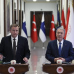 
              In this handout photo provided by the Turkish Defense Ministry, Turkish Defense Minister Hulusi Akar, right, and Finnish Defense Minister Antti Kaikkonen speak to the media after their talks in Ankara, Turkey, Thursday, Dec. 8, 2022. Kaikkonen visits Ankara, meets with his counterpart Akar as Ankara continues to hold up Helsinki's bid to join NATO. (Turkish Defense Ministry via AP)
            