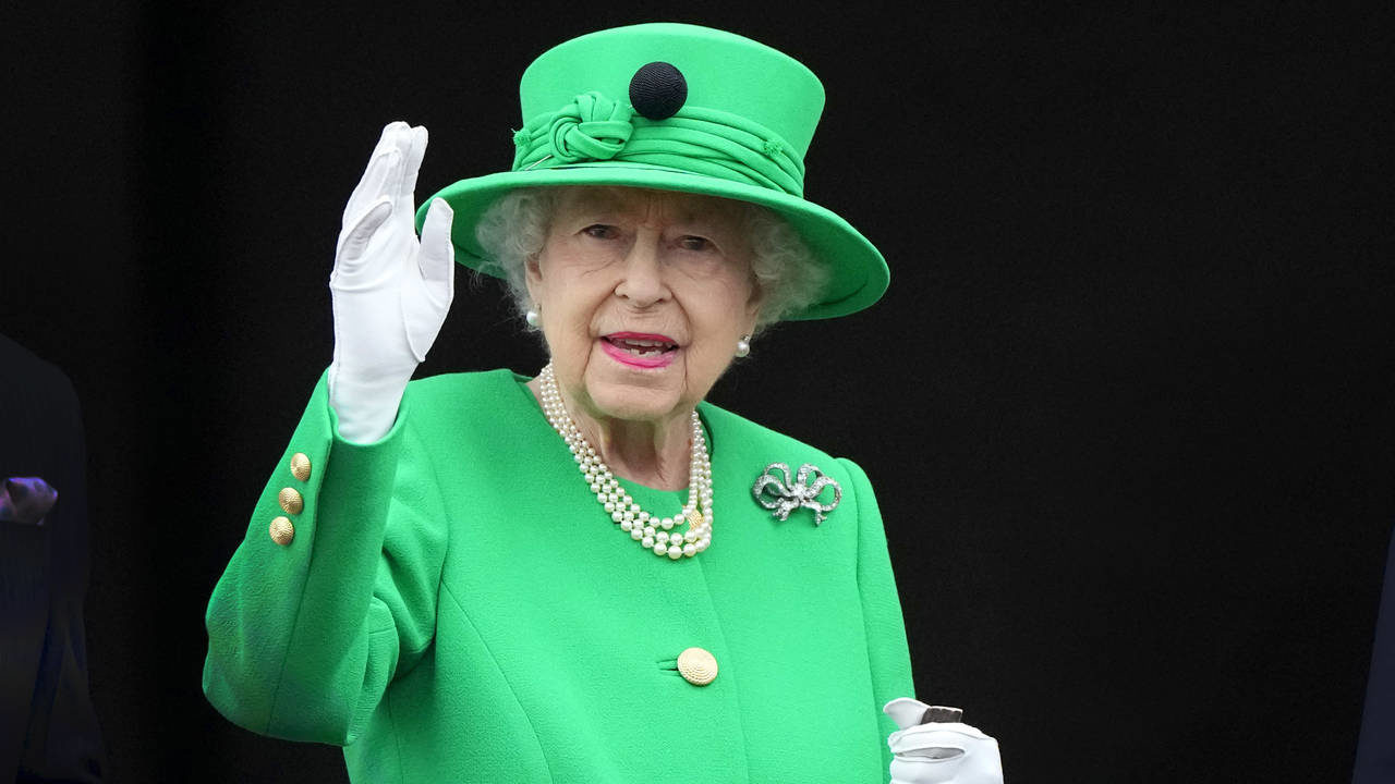 FILE - Britain's Queen Elizabeth II waves to the crowd during the Platinum Jubilee Pageant at the B...
