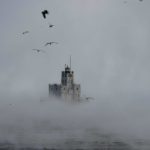 
              Steam rises off of Lake Michigan as morning temperatures remain below zero with heavy winds Friday, Dec. 23, 2022, in Milwaukee.  Winter weather is blanketing the U.S. as a massive storm sent temperatures crashing and created whiteout conditions. (AP Photo/Morry Gash)
            