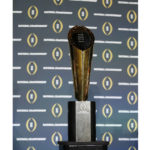 
              FILE - The national championship trophy is seen before a new conference for the NCAA college football playoff championship game between Clemson and Alabama, Sunday, Jan. 10, 2016, in Glendale, Ariz. The College Football Playoff announced Thursday, Dec. 1, 2022, it will expand to a 12-team event, starting in 2024, finally completing an 18-month process that was fraught with delays and disagreements.The announcement comes a day after the Rose Bowl agreed to amend its contract for the 2024 and '25 seasons, the last hurdle CFP officials needed cleared to triple the size of what is now a four-team format.(AP Photo/David J. Phillip, File)
            