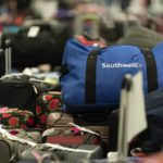 
              Hundreds of Southwest Airlines checked bags are piled at baggage claim at Midway International Airport as Southwest continues to cancel thousands of flights across the country Wednesday, Dec. 28, 2022, in Chicago. (AP Photo/Erin Hooley)
            