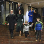 
              Boston Mayor Michelle Wu, back, second right, husband Conor Perwarski,top right, and sons Blaise, center, and Cass and Gov.-elect Maura Healey, back, third right, walk with Britain's Prince William and Kate, Princess of Wales, in Boston City Hall on Wednesday, Nov. 30, 2022, in Boston. The Prince and Princess of Wales are making their first overseas trip since the death of Queen Elizabeth II in September. (Nancy Lane/The Boston Herald via AP, Pool)
            
