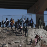 
              Migrants cross the U.S.-Mexico border from Ciudad Juarez, Mexico, and turn themselves into U.S. Border Patrol agents, Monday, Dec. 19, 2022. Pandemic-era immigration restrictions in the U.S. known as Title 42 are set to expire on Dec. 21. (AP Photo/Christian Chavez)
            