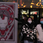 
              Residents wearing masks visit a mall in Beijing, Wednesday, Dec. 28, 2022. China says it will resume issuing passports for tourism in another big step away from anti-virus controls that isolated the country for almost three years, setting up a potential flood of Chinese going abroad for next month's Lunar New Year holiday. (AP Photo/Ng Han Guan)
            