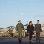 
              Air Chief Marshal Mike Wigston, left and Station Commander for RAF Coningsby Billy Cooper walk with Britain's Prime Minister Rishi Sunak during his visit to RAF Coningsby in Lincolnshire, England, Friday, Dec. 9, 2022,  following the announcement that Britain will work to develop next-generation fighter jets with Italy and Japan. (Joe Giddens/Pool Photo via AP)
            