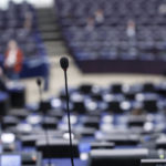 
              A microphone is pictured in an almost empty hemicycle of the European Parliament during a debate. in Strasbourg, eastern France, Tuesday Dec 13, 2022. (AP Photo/Jean-Francois Badias)
            